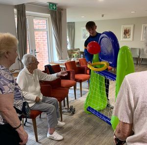 Residents playing indoor basketball