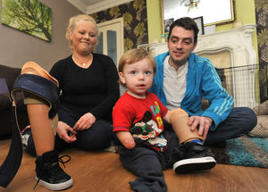 Tommy with his mum Julie and dad Dean 