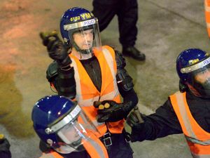 PICTURE FROM THE ARCHIVE: There’s a riot going on, but don’t panic, it is all just an exercise. This image from 2017 was taken at RAF Cosford, where the hangars and airfield were used to replicate major disorder and showing officers from forces across the Midlands how they can respond safely. 