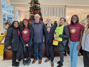 Members of the Rotary Club and Wolverhampton University Rotaract club pose with the Mayor by the tree