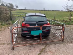Supporting image for story: Fuming farmer builds metal fence in revenge on BMW driver who blocked gate