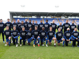 Supporting image for story: 'Get well soon gaffer' Shrewsbury Town players warm up against Fleetwood with t-shirts in support of absent boss Steve Cotterill 
