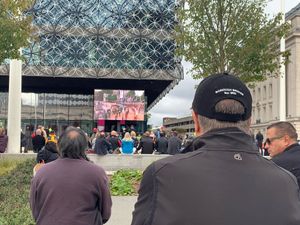 People watch the funeral of Queen Elizabeth II on a big screen in Centenary Square, Birmingham. Photo: Richard Vernalls/PA Wire