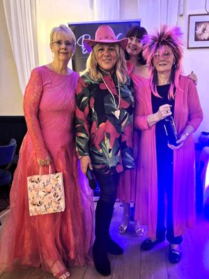 Wear it Pink best dressed winners (from left to right) Mandy, Lions President Debra, Chris with singer Becca G in the back ground
