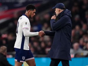 England manager Thomas Tuchel shakes hands with Jude Bellingham