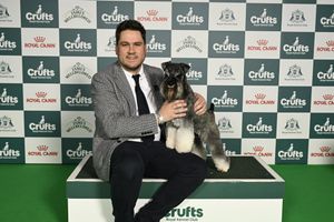 Tom Braithwaite from Durham, with Spencer, a Miniature Schnauzer, which was the Best of Breed winner today (07.03.26), the third day of Crufts 2026. Credit: Royal Kennel Club/BeatMedia