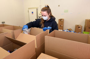 Hannah Lewis-Rhodes preparing food parcels at Shropshire Food Enterprise Centre, to go out to residents