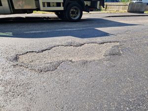 One woman said she was 'nearly hit by a car' when her flip-flop became glued to the melting road