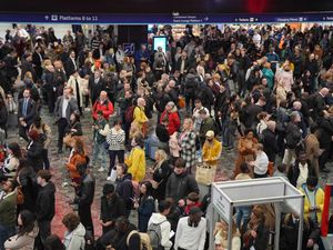 Passengers waiting on the concourse at Euston station