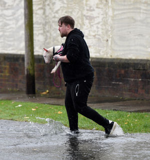 One man rescues his dog in Park Lane West. Picture: Tim Thursfield