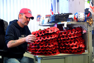 Seeing red – veteran Gregg Howell stacks up the wreaths