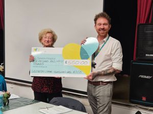 Jean Martin presents a cheque to representative of Severn Hospice.