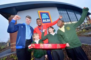 Olympian Joel Fearon with store manager Liam Jones and Ryders Green Primary School pupils Crystal Gamble, Freya Asini, and Zoe Bisengo