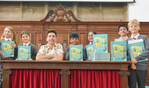 Author and comedian Russell Kane meets pupils at his Pet Selector book launch at Wolverhampton Grammar School