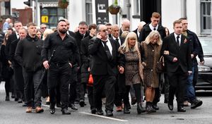 The military funeral of Northern Ireland veteran Luke Smith, at St Michael's and All Angels Church, Penkridge.Family members make their way towards the church.