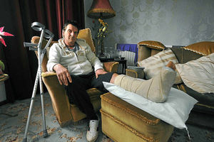 Stuart Timmins is recovering from a broken ankle after he was dragged along the road while trying to stop his car being stolen