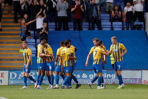 Sam Cosgrove of Shrewsbury Town celebrates with his team mates after scoring a goal to make it 1-0. (AMA)