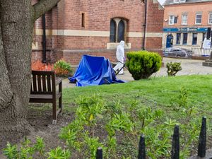 There was a blue tarpaulin visible on the grounds of the church