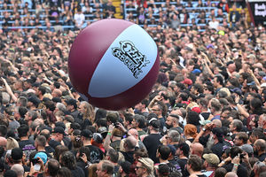The Villa Park crowd plays with a huge beach ball as they watch support acts, during British rock band Black Sabbath's "Back to The Beginning" concert, Ozzy Osbourne's final ever gig as Black Sabbath's frontman at Villa Park in Birmingham, central England on July 5, 2025. Osbourne, who revealed in 2020 that he has Parkinson's disease, will join Tony Iommi, Geezer Butler and Bill Ward for the all-day "Back To The Beginning" show in Birmingham, central England, where the heavy metal giants formed in 1968. (Photo by ANDY BUCHANAN / AFP) (Photo by ANDY BUCHANAN/AFP via Getty Images)          