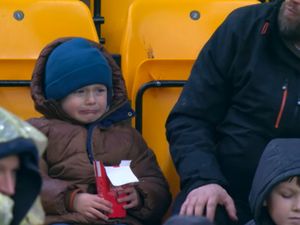 Supporting image for story: Sweet surprise young Wolves fan who went viral after he was caught on camera in tears when his chicken nuggets were stolen during a match