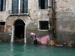 Supporting image for story: Banksy work The Migrant Child removed from Venetian palazzo for restoration