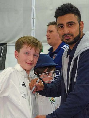 Javid signs Henry Spencer's shirt