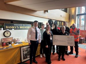 Supporting image for story: Banks's staff help raise £16,000 for Wolverhampton's Compton Care after holding of memorabilia auction