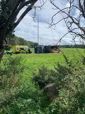 The lorry tipped and shed its load on the roadside