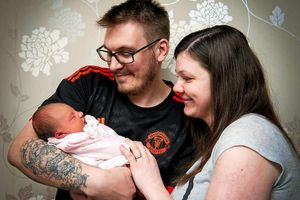 Delighted new parents Lisa Pooler and Chris Stokes with baby Evie-Sue Mary Stokes, who was born on the bathroom floor