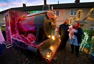Shaun Pickering, pictured with wife, Katie, and 15 week old daughter Matilda, next to the huge Hogwarts Express that he built