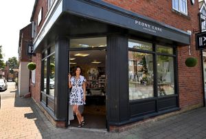 Andrea outside the shop