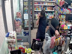 Supporting image for story: Watch:  Moment machete-wielding thug was locked in shop by heroic staff after attempted robbery