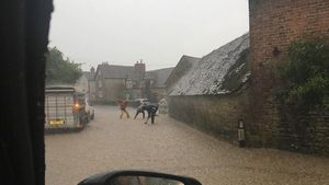 Clearing the drains during heavy rain at Munslow. Photo: Russell Bufton