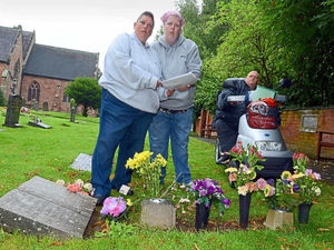 Supporting image for story: Relatives stage sit-in over grave tributes removal