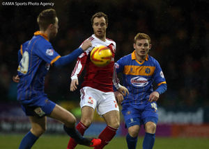 Fraser Fyvie of Shrewsbury Town and Ryan Harley of Swindon Town