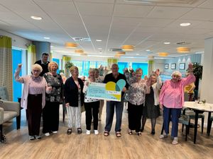 John celebrates with his fellow neighbours at Withywood