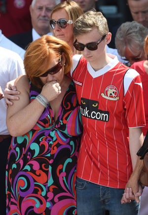 Owen comforts his mother at the Banks's Stadium days after the attack