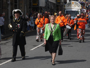 Town crier Derrick with Councillor Chris Branford, then Knighton Mayor, leading last year's carnival parade