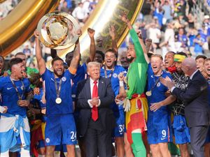 Supporting image for story: Confusion as Donald Trump joins Chelsea on stage after Club World Cup win