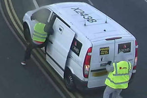 The two robbers target the van outside Walsall Housing Group