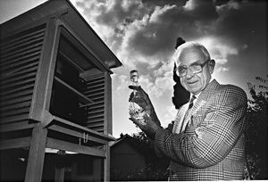 'Come rain or shine, every morning at 9am John Day can be found at the bottom of his garden in Aldridge. For 50 years he has checked rain gauges, thermometers and hydrometers and logged the details for the Metrological Office. He said "Once you start you have to keep recording... Year by year it gets more interesting  and you can look back at what happens." Dates which stick in his mind include February 13, 1947 - the day his son was born.' John is pictured here with his commemorative crystal decanter as the Met Office's longest-running amateur weather observer, from his garden observatory in Walsall Wood Road, Aldridge in August 1993.