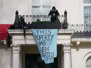 Supporting image for story: Protesters on oligarch’s balcony have ‘made peace with getting arrested’