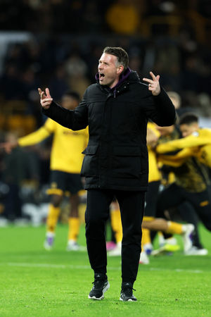 Rob Edwards celebrates a famous Wolves victory (Photo by David Rogers/Getty Images)