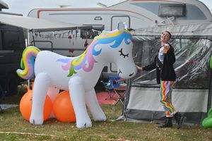 Alice Brien, from Huntington, with a unicorn at the folk festival