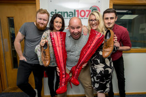 Dicky Dodd and the team at Signal 107 with the famous boots
