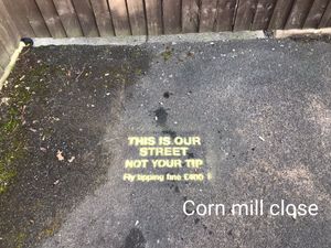 Supporting image for story: Warnings to fly-tippers being sprayed on streets as council cleans up dumped rubbish