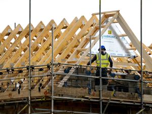 A builder works on a house under construction in Kent