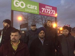 Some of the protesting taxi-drivers outside the Go Carz offices