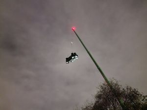 The car was craned out of the canal after dark. Photo: Lee Bates
