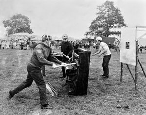 June 26, 1967: The caption reads: 'Rain did not dampen the spirits of the young men who took part in a piano smashing competition at Claverley on Saturday. Admirers of these faithful old uprights had to grin and bear it as one team after another made short work of the craftsman-built instruments. Here the team from the National Foundry College show how it is done. The event was part of a fete towards raising £1,000 for the rebuilding of the village hall... the present village hall was built of timber in the 1920s and a permanent replacement would cost nearly £10,000.' 